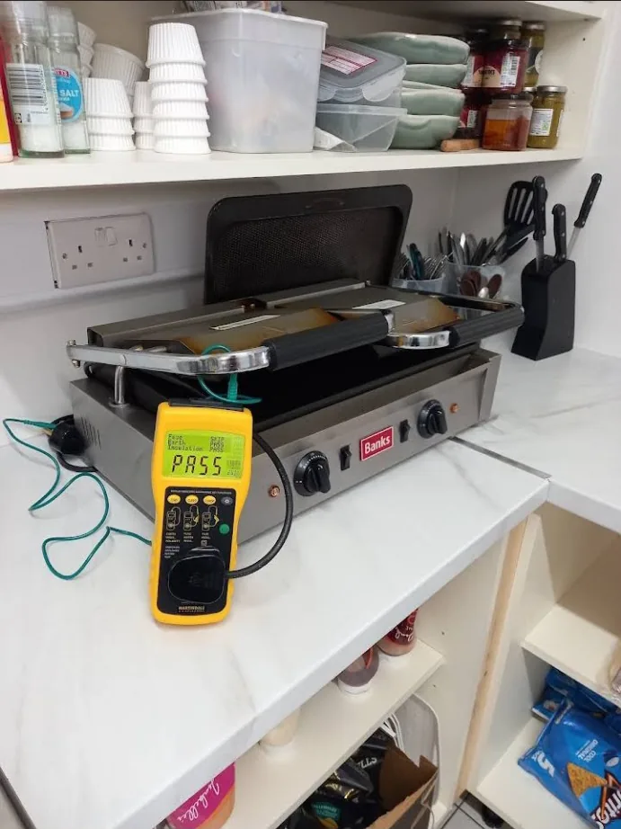 Commercial catering griddle being PAT tested